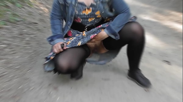 Hairy mature in transparent dress flashing in the park