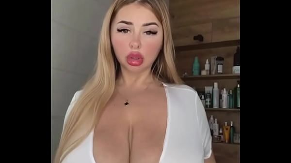 An adult MILF with natural tits is waiting, caressing