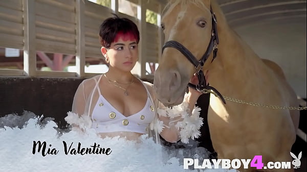 Big tits Latin babe exposing hot body before riding lesson for the Playboy